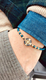 bracciale rosa dei venti in oro giallo con ematite blu  e zaffiri