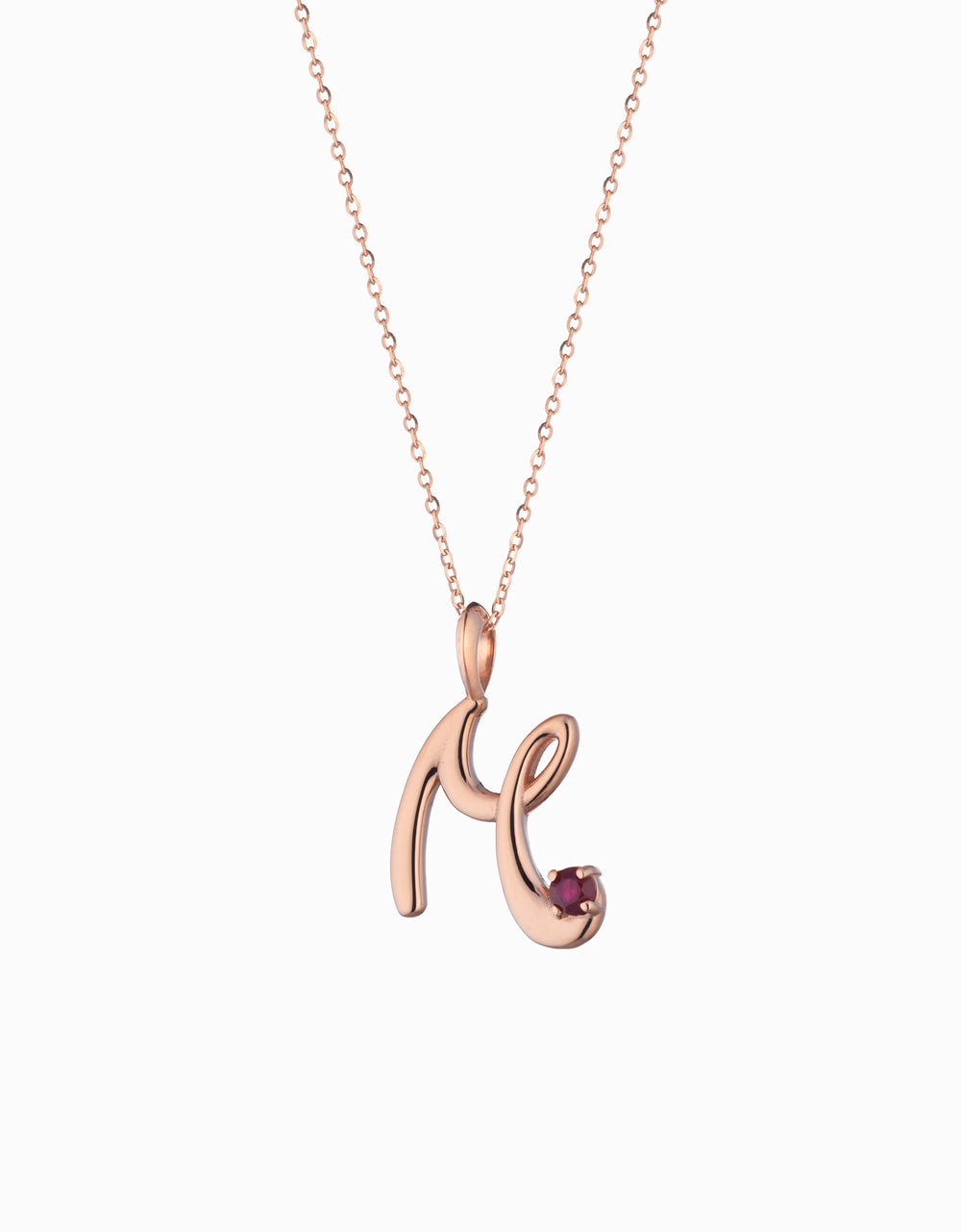 ciondolo in oro rosa con lettera personalizzata con rubino