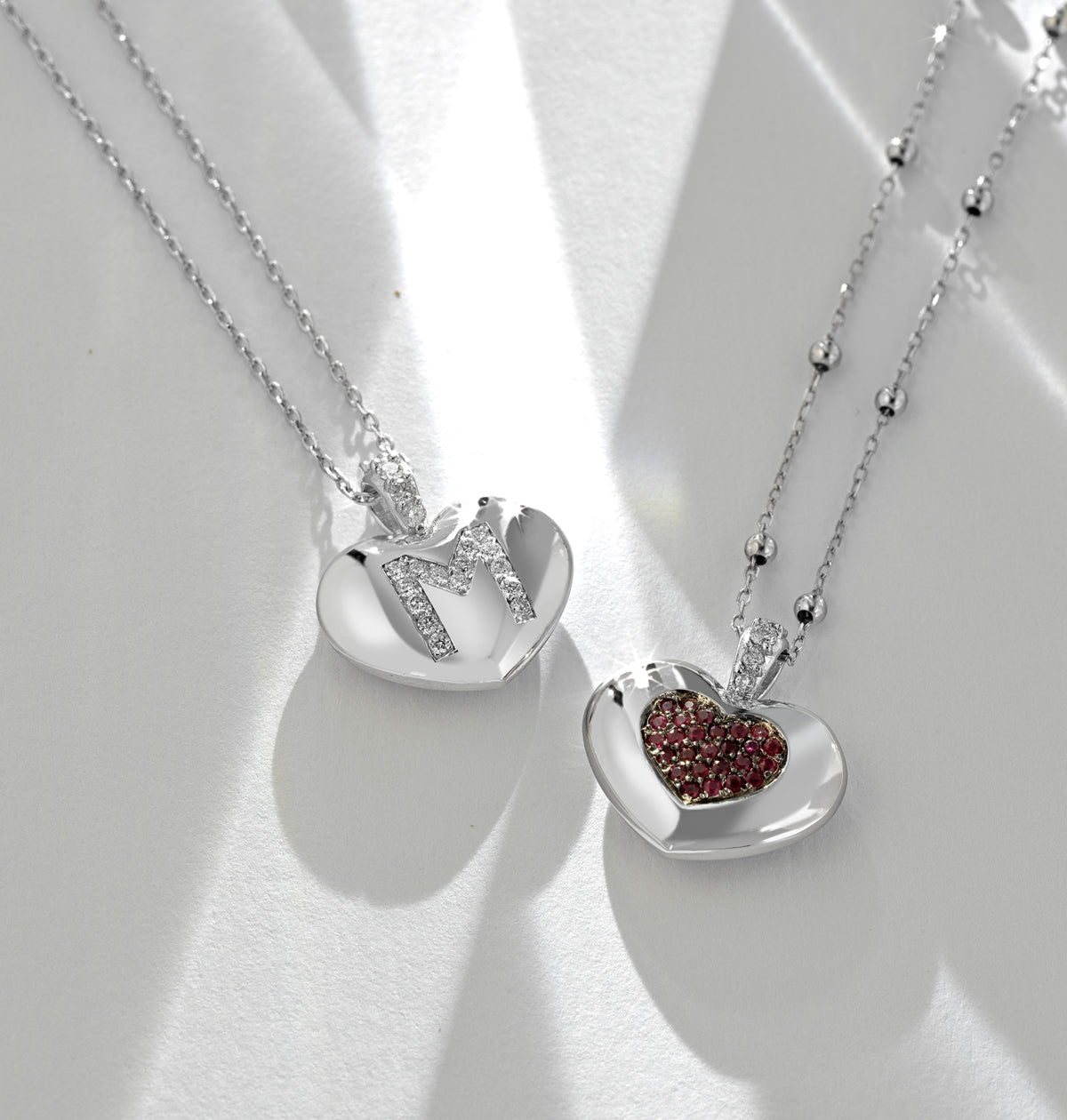 CIONDOLO IN ORO BIANCO CON CUORE DI DIAMANTI