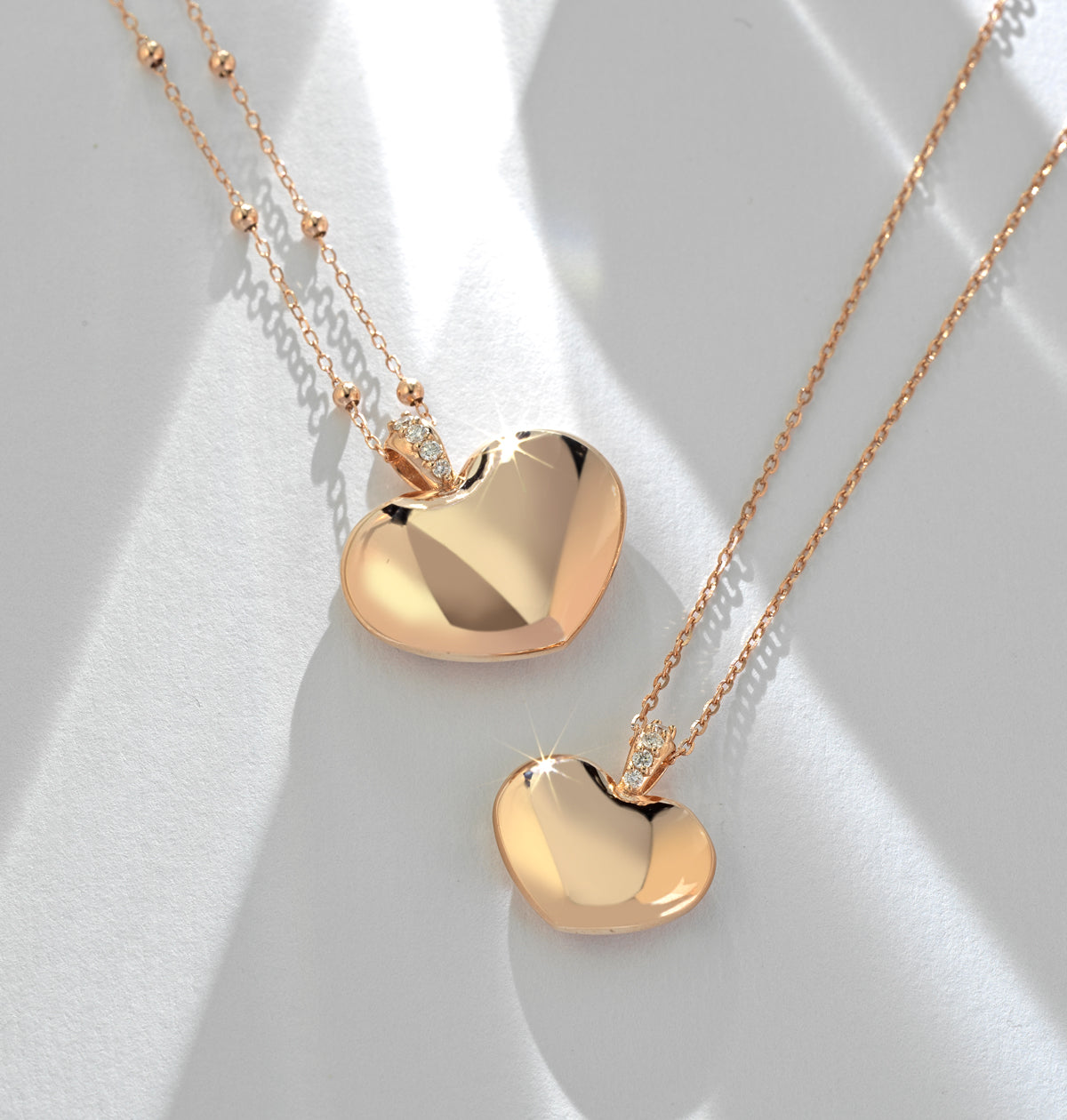 CIONDOLO IN ORO ROSA CON CUORE DI DIAMANTI