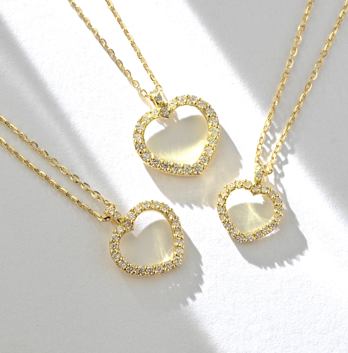 CIONDOLO IN ORO GIALLO CON CUORE PICCOLO APERTO DI DIAMANTI