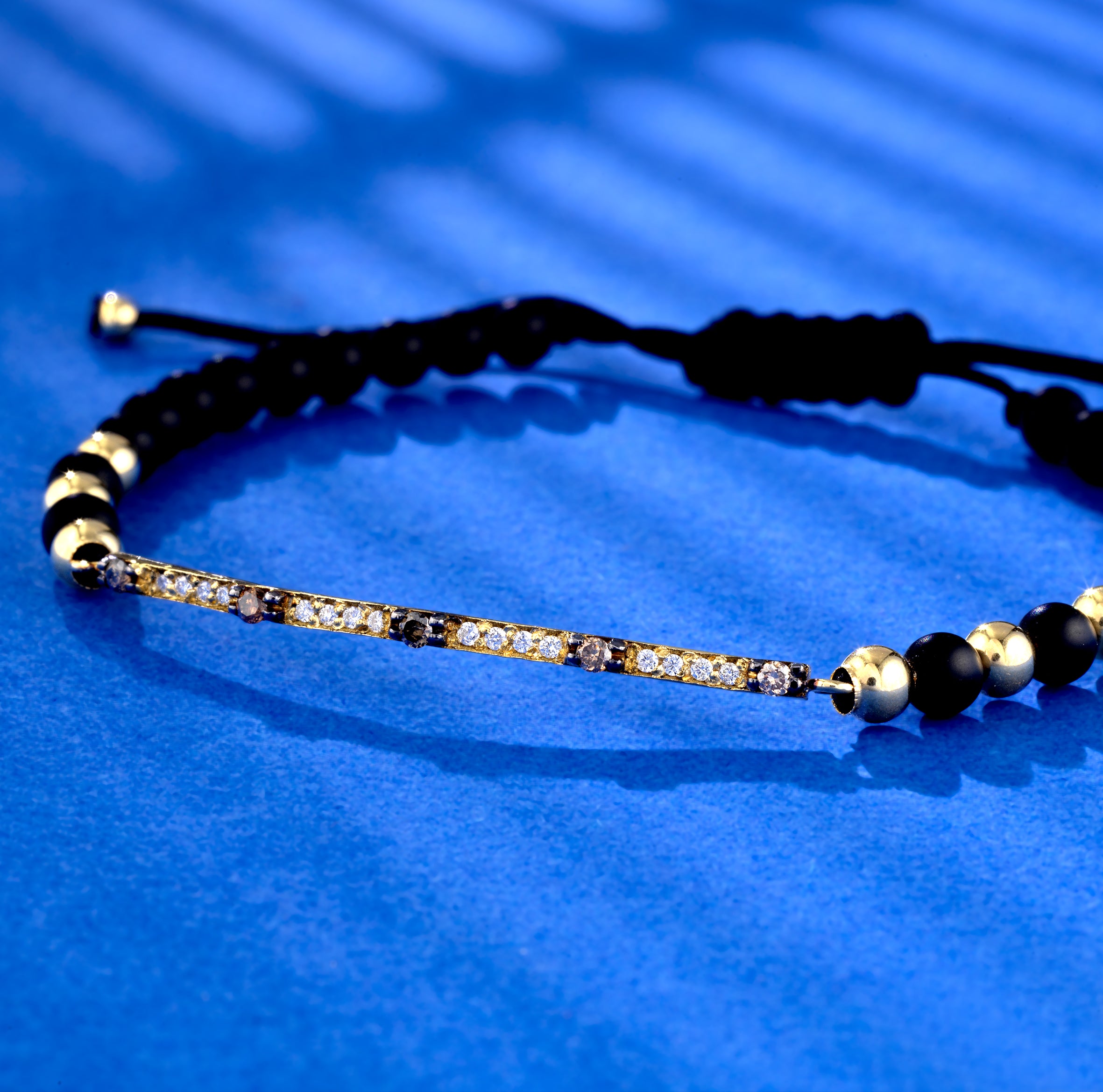 BRACCIALE CON LACCIO IN ORO GIALLO BACCHETTA DI DIAMANTI E PIETRE BROWN