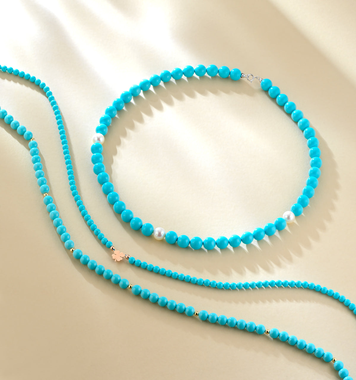 COLLANA CON PASTA DI TURCHESE E QUADRIFOGLIO CENTRALE IN ORO ROSA