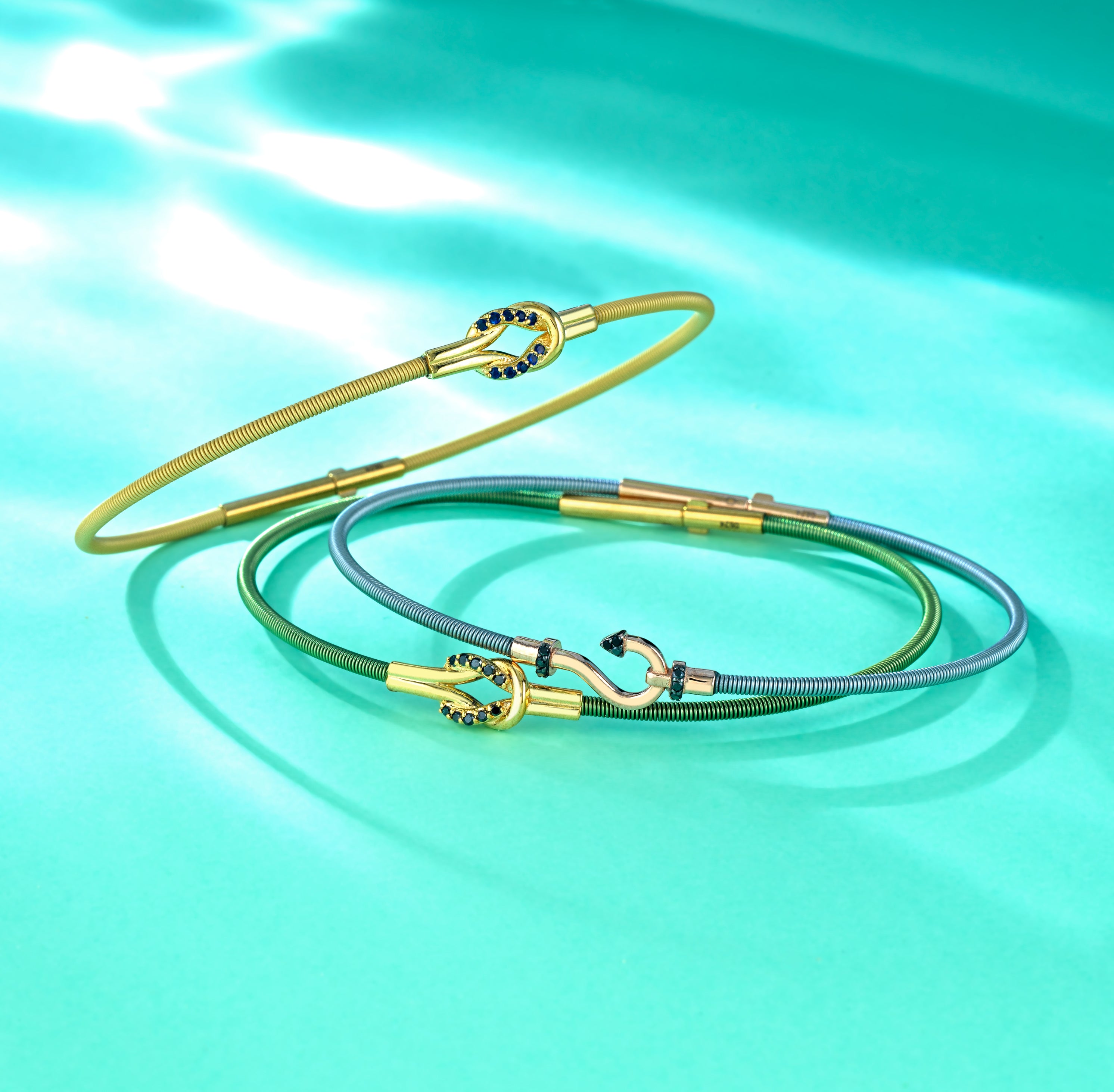 BRACCIALE GRIGIO IN ORO ROSA CON AMO CENTRALE E DIAMANTI NERI