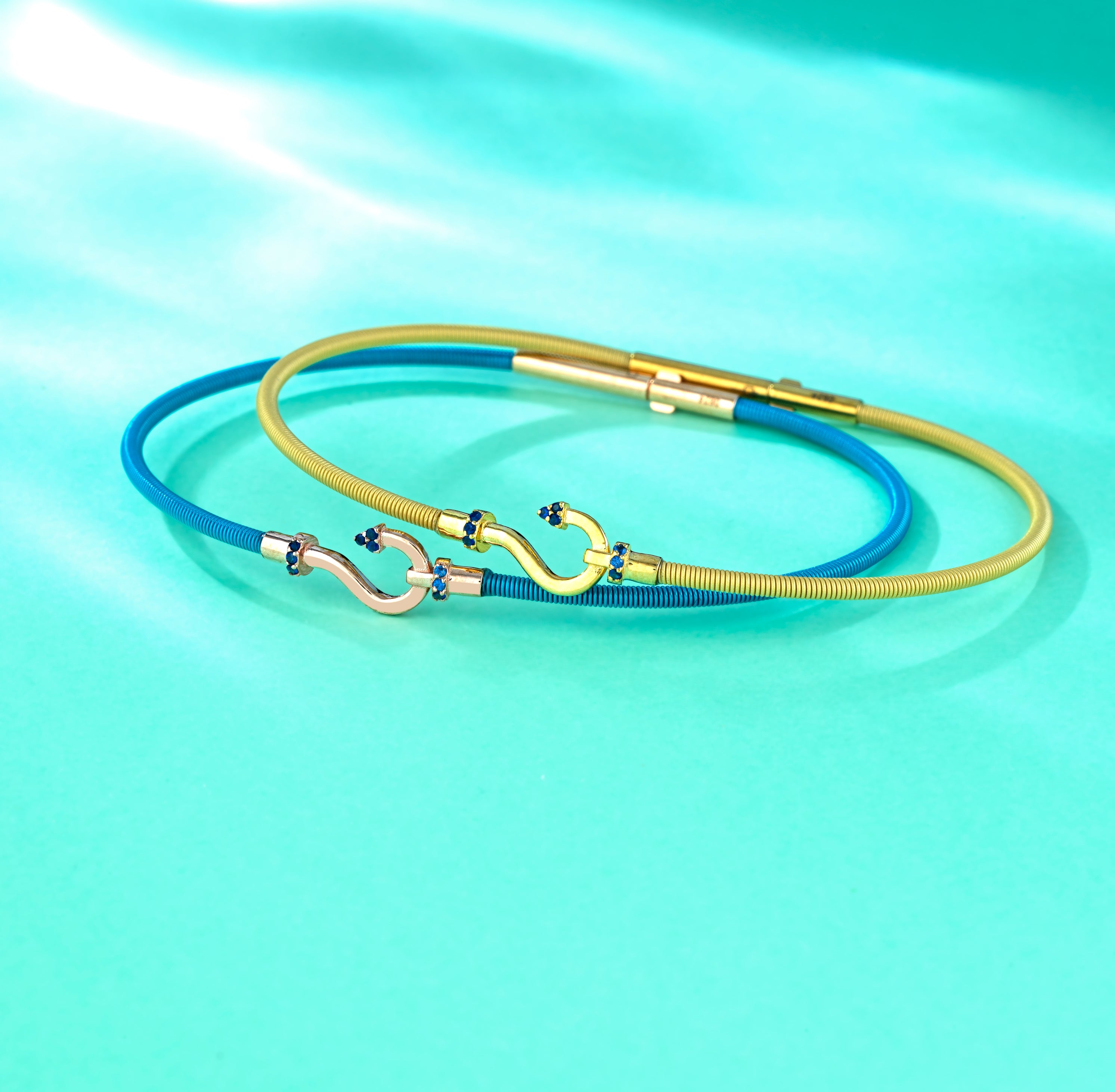 BRACCIALE BLU IN ORO ROSA CON AMO CENTRALE DI ZAFFIRI