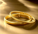 BRACCIALE IN ORO  GIALLO IN 18KT SOTTILE, CON TITANIO