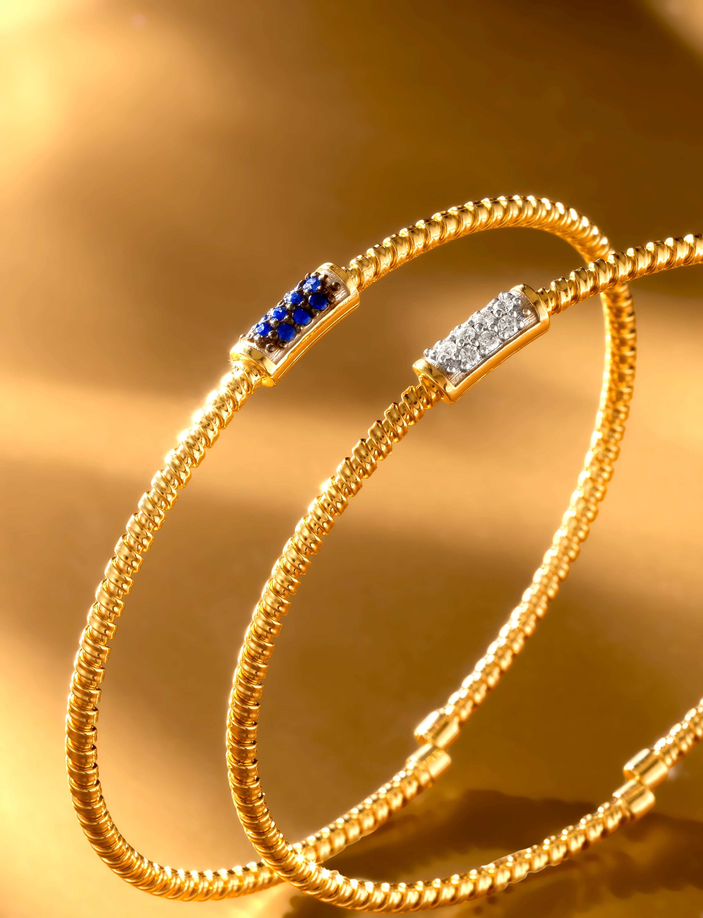 BRACCIALE IN ORO GIALLO 18KT CON TITANIO E DIAMANTI CENTRALI