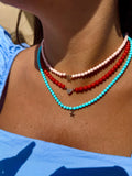 COLLANA CON PASTA DI CORALLO ROSA IN ORO ROSA CON LETTERINA CENTRALE