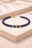 BRACCIALE IN CERAMICA BLU CON GRUMETTE CENTRALI E CHIUSURA IN ORO 9KT