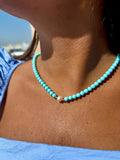 COLLANA CON PASTA DI TURCHESE CON PERLA CENTRALE CHIUSURA E PALLINE IN ORO