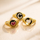 ANELLO SIGILLO IN ORO GIALLO CON CUORE DI RUIBINI