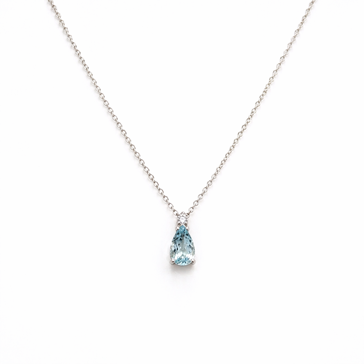CIONDOLO IN ORO 9KT, ORO BIANCO CON DIAMANTINO E ACQUAMARINA A GOCCIA