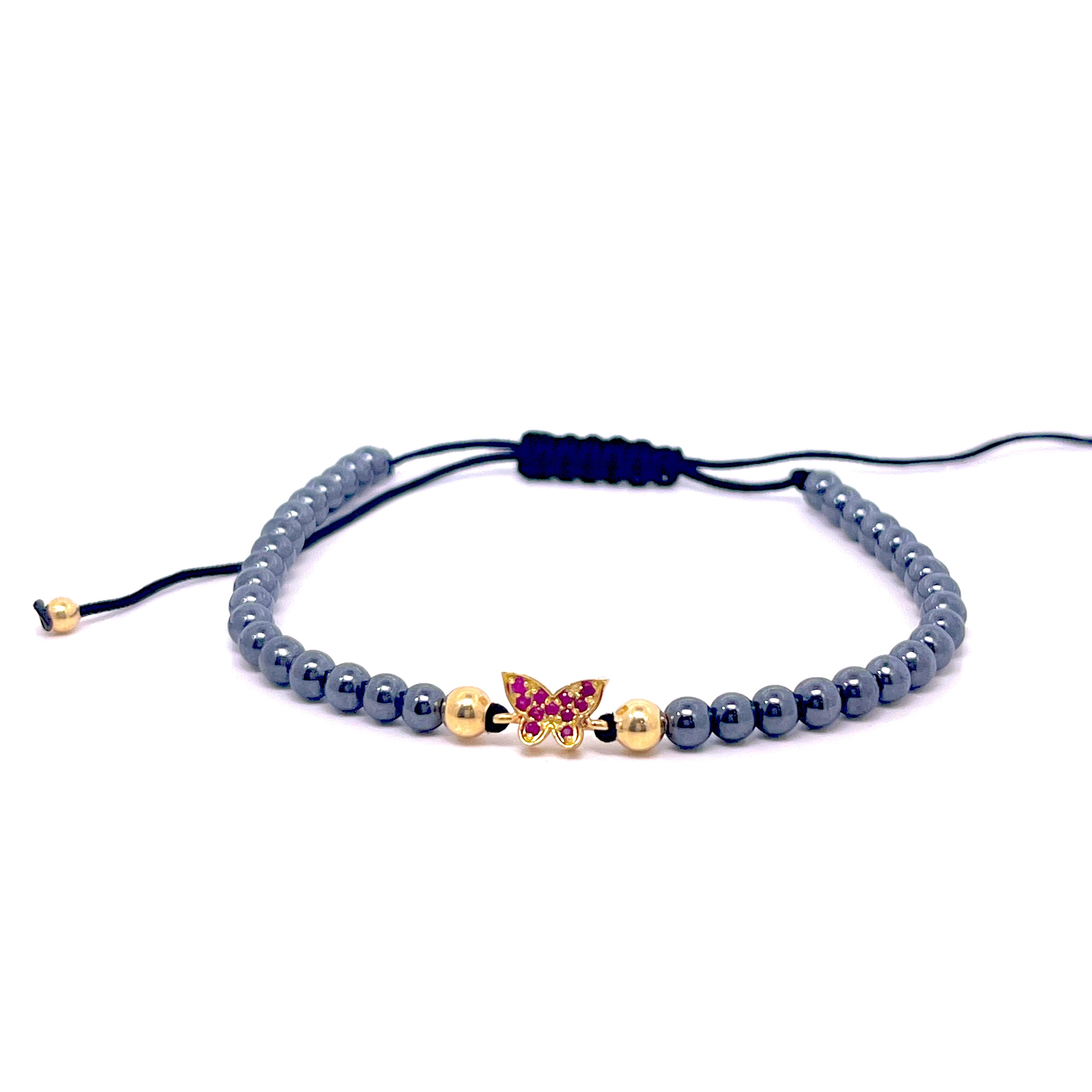 BRACCIALE CON FARFALLA CENTRALE E RUBINI IN ORO GIALLO ED EMATITE