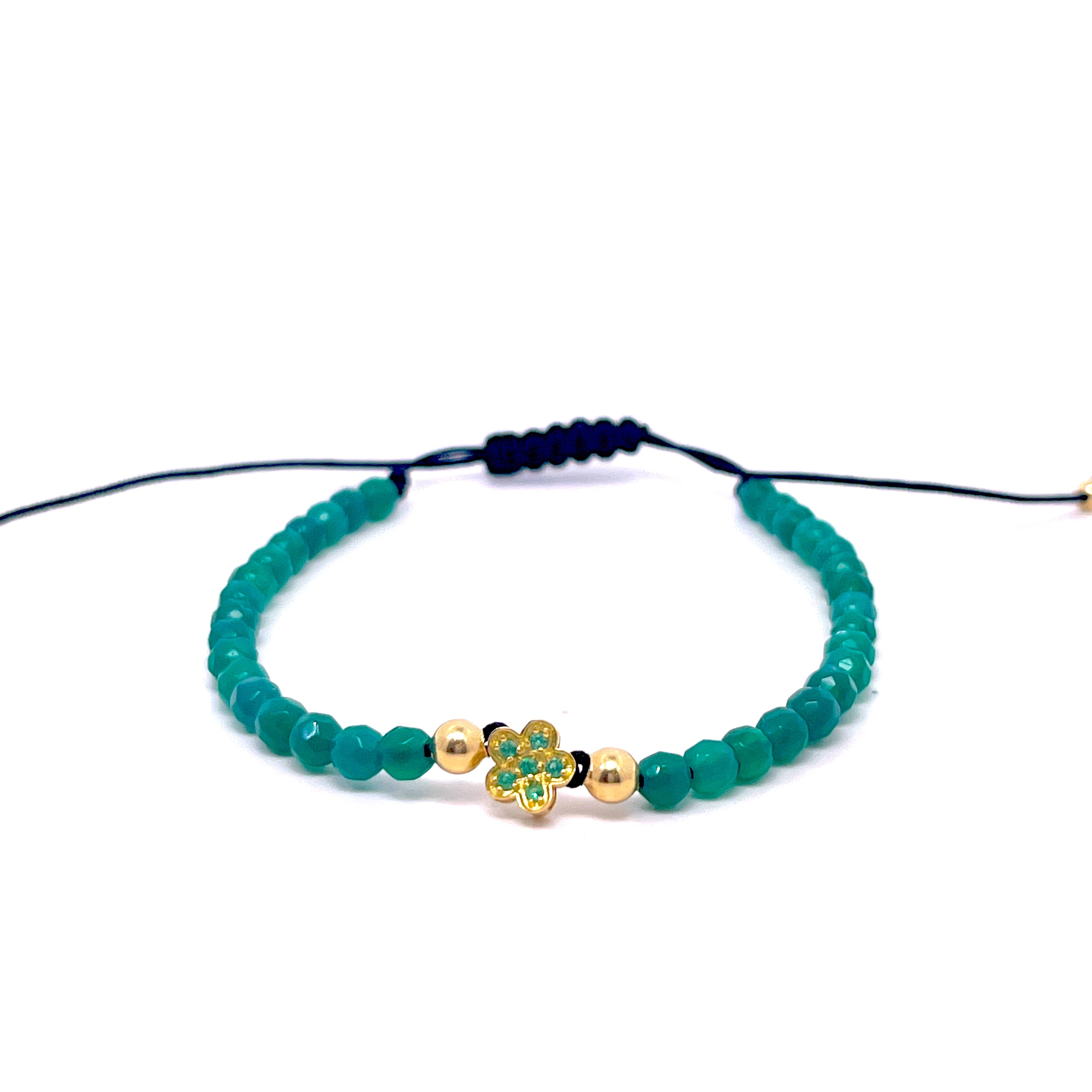 BRACCIALE CON QUADRIFOGLIO CENTRALE E SMERALDI IN ORO GIALLO ED EMATITE