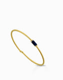 BRACCIALE IN ORO GIALLO 18KT CON TITANIO E ZAFFIRI  CENTRALI