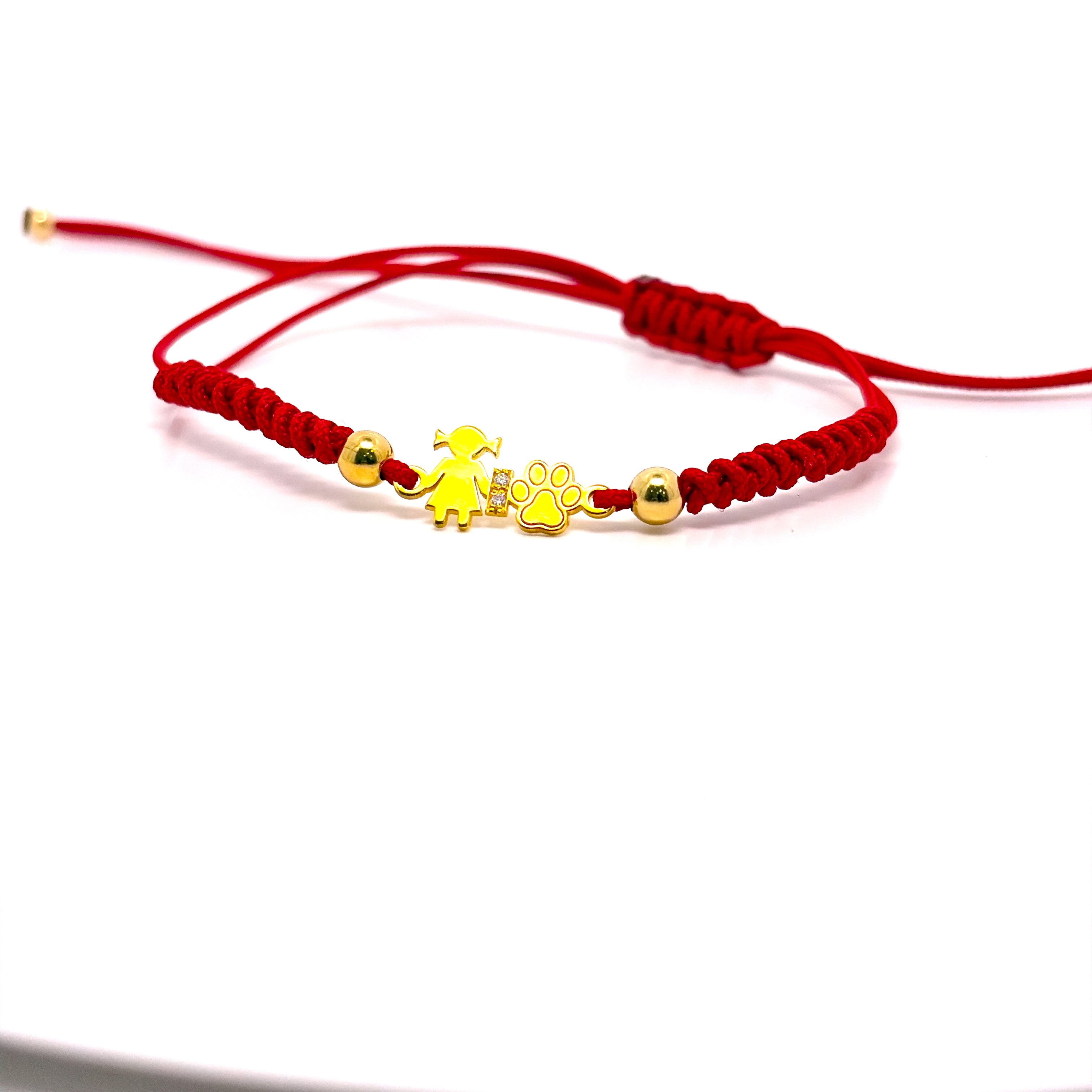 BRACCIALE IN ORO GIALLO, ORO 9KT BIMBA E ZAMPA CON DUE DIAMANTINI