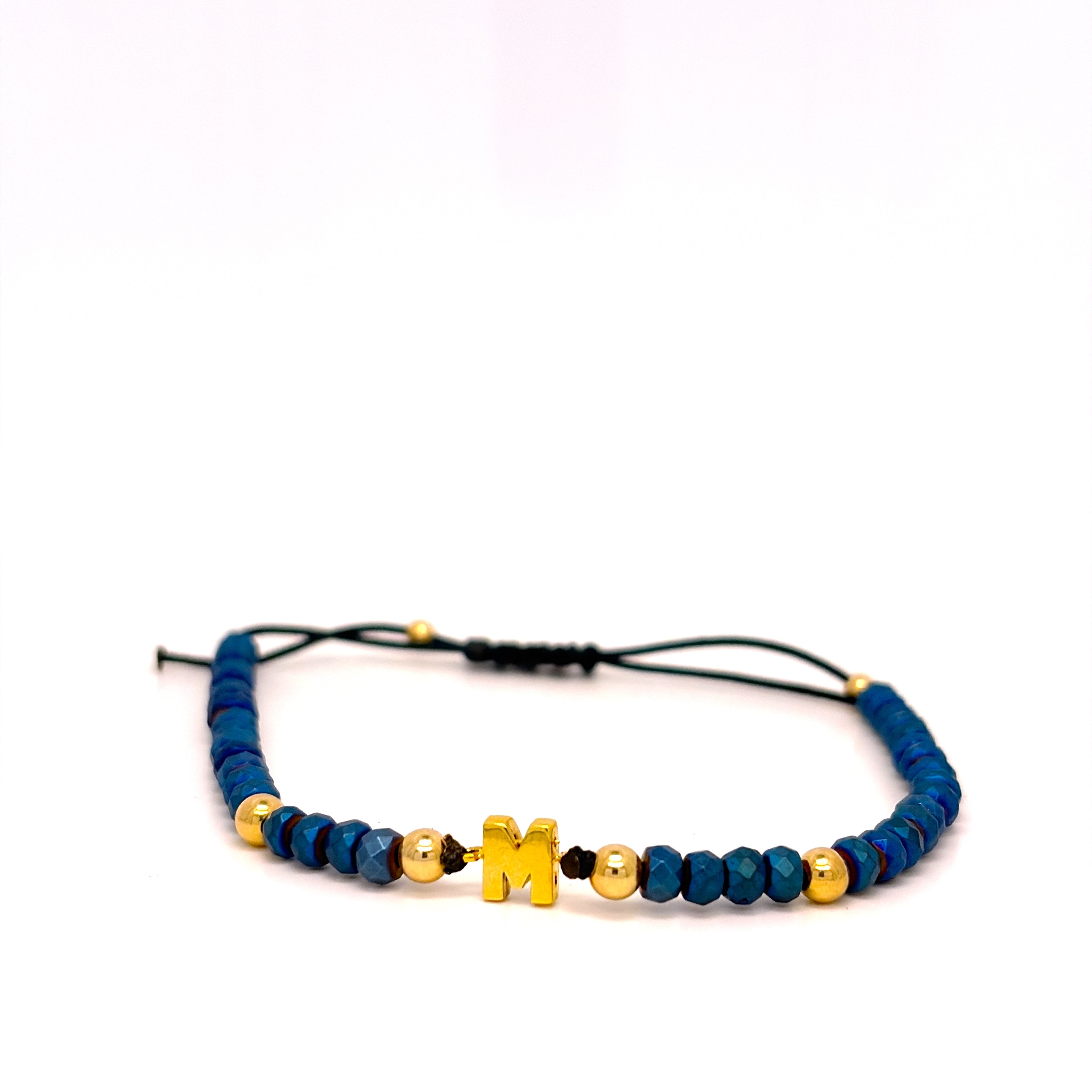 BRACCIALE 9KT, IN ORO GIALLO CON LETTERA ED EMATITE