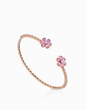 BRACCIALE IN ORO ROSA CON DIAMANTI E DUE FIORI CON PIETRE DI ZAFFIRI ROSA