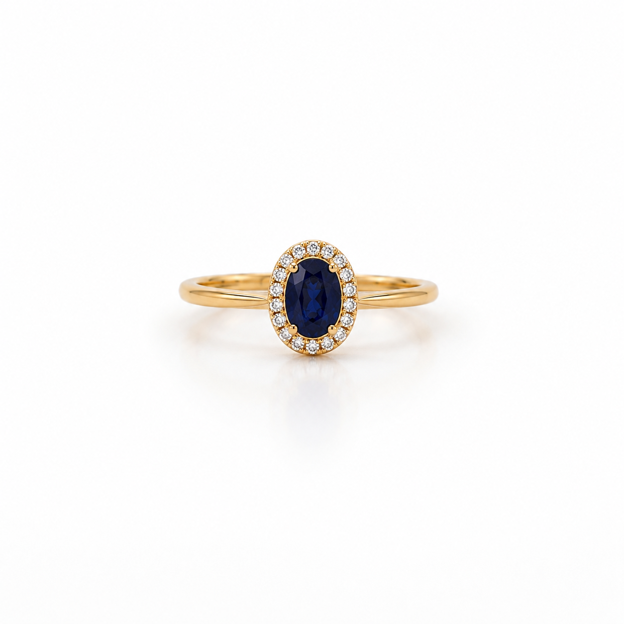 ANELLO IN ORO GIALLO, CON DIAMANTI E OVALE ZAFFIRO CENTRALE