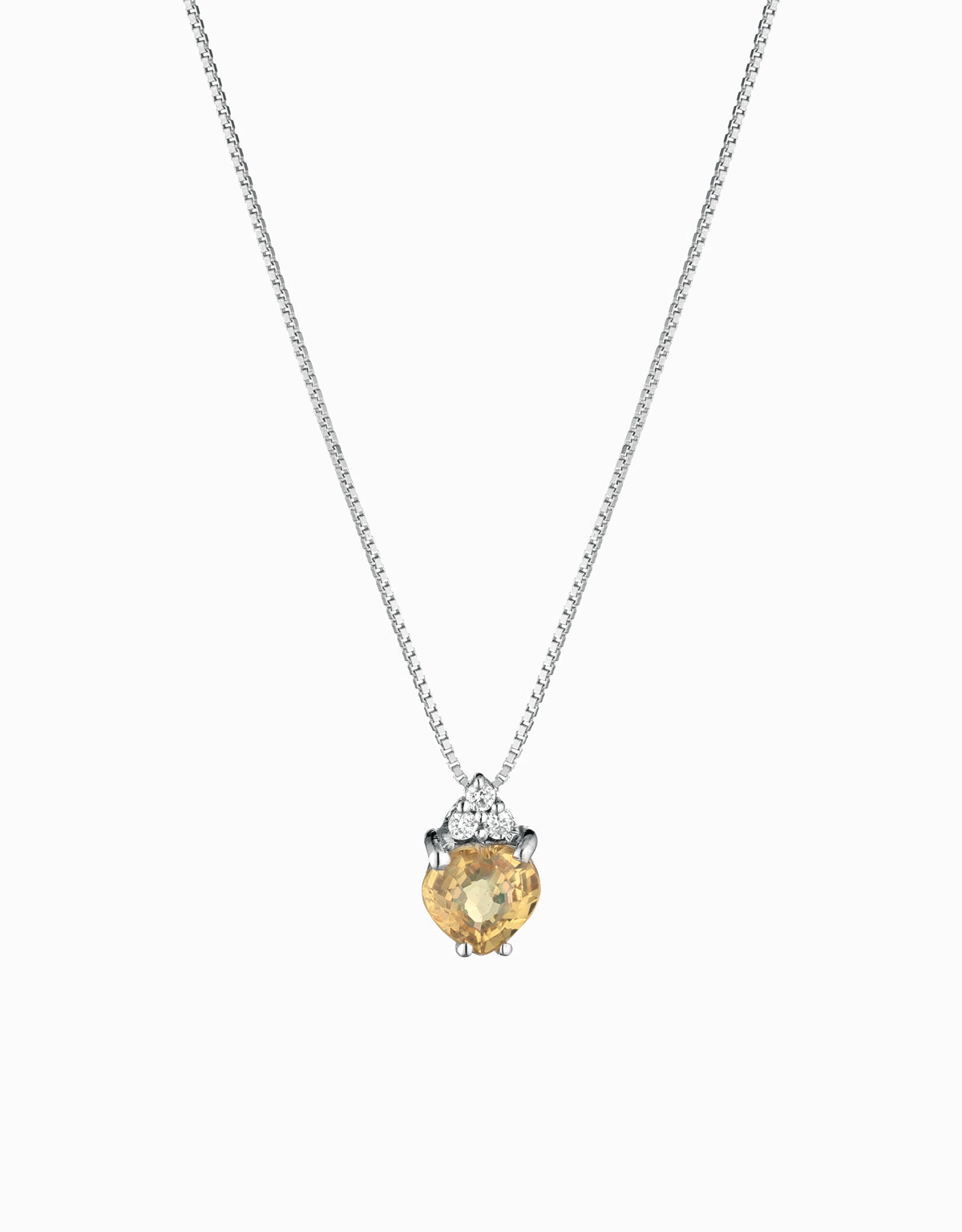 CIONDOLO CON CUORE CENTRALE DI TOPAZIO IN ORO BIANCO CON TRE DIAMANTINI