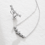 MONO ORECCHINO LUNGO IN ORO BIANCO CON FIORI DI DIAMANTI