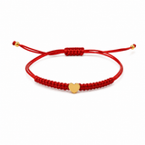 BRACCIALE CON CORDINO ROSSO E CUORE CENTRALE IN ORO GIALLO
