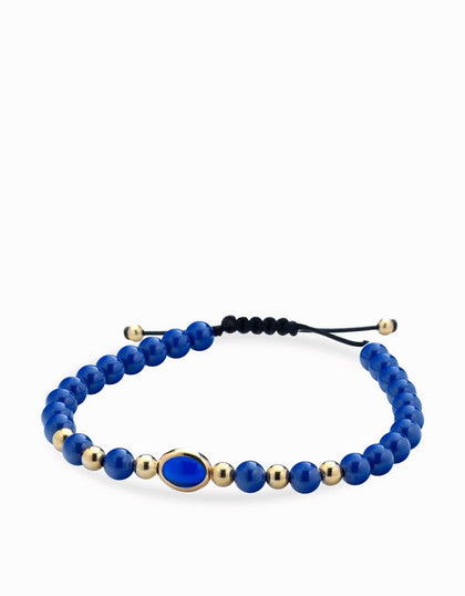 Bracciale con sfere in ceramica blu e oro giallo e pietra centrale blu Dalù Gioielli 
