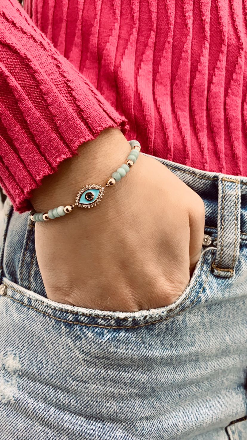 bracciale occhio con ematite oro rosa zaffiro centrale e diamanti