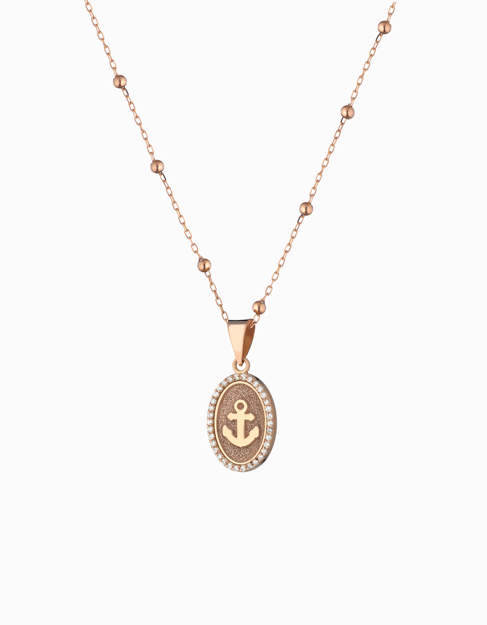 ciondolo in oro rosa con ancora centrale  e diamanti